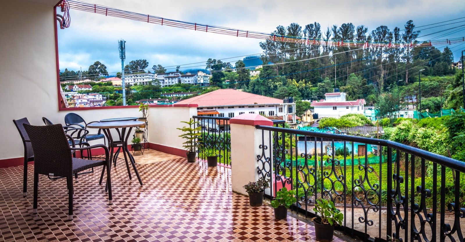 Aakash Rooms and Cottages photographed from outside on a bright Ooty day